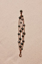 Music Bracelet Four Strand Black